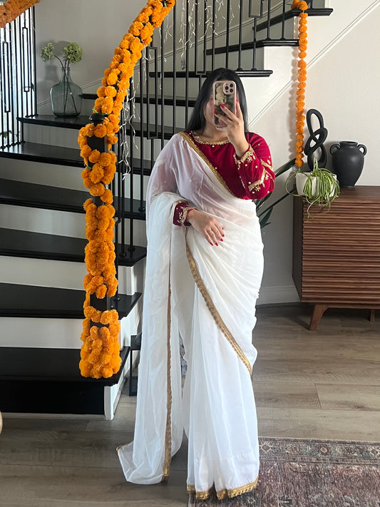 Boutique work white sari with rani pink blouse